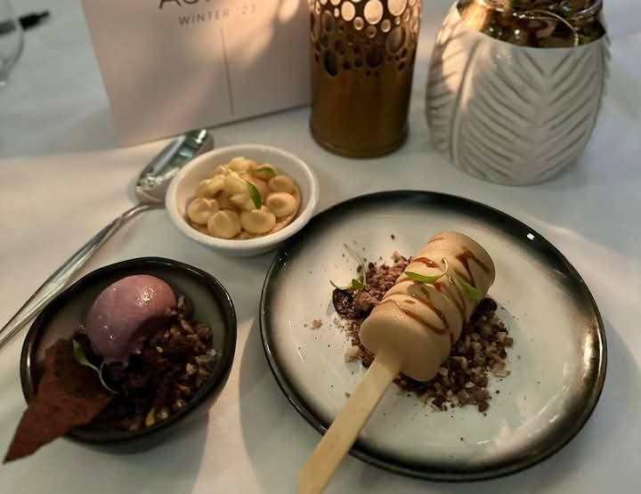 Beautifully presented desserts. Aurum Magnum and Blueberry Pistachio